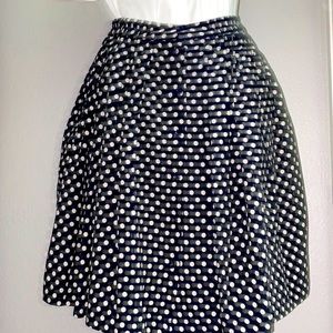 Pleated navy blue skirt with white polka dots